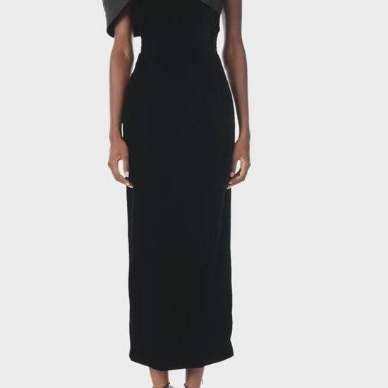 Monique Lhuillier Fall 2024 asymmetric, off the shoulder sheath dress in noir silk faille and velvet with draped twist detail at neckline - video.