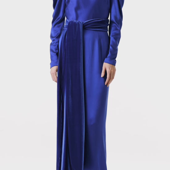 Monique Lhuillier long sleeve royal blue gown with Bateau neckline and velour detached sash.