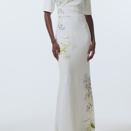 Monique Lhuillier Spring 2026 Ivory/Multi Iris Bouquet Printed CrepeShort sleeve bias gown - video.