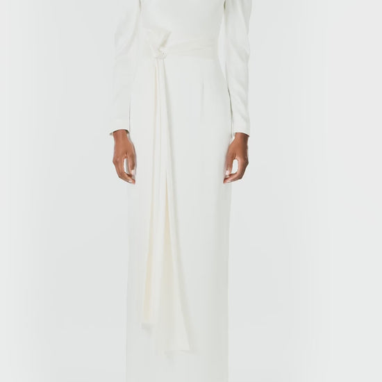 Monique Lhuillier Fall 2024 Long sleeve silk white satin gown with Bateau neckline, V-back and detached self-tie sash - video.