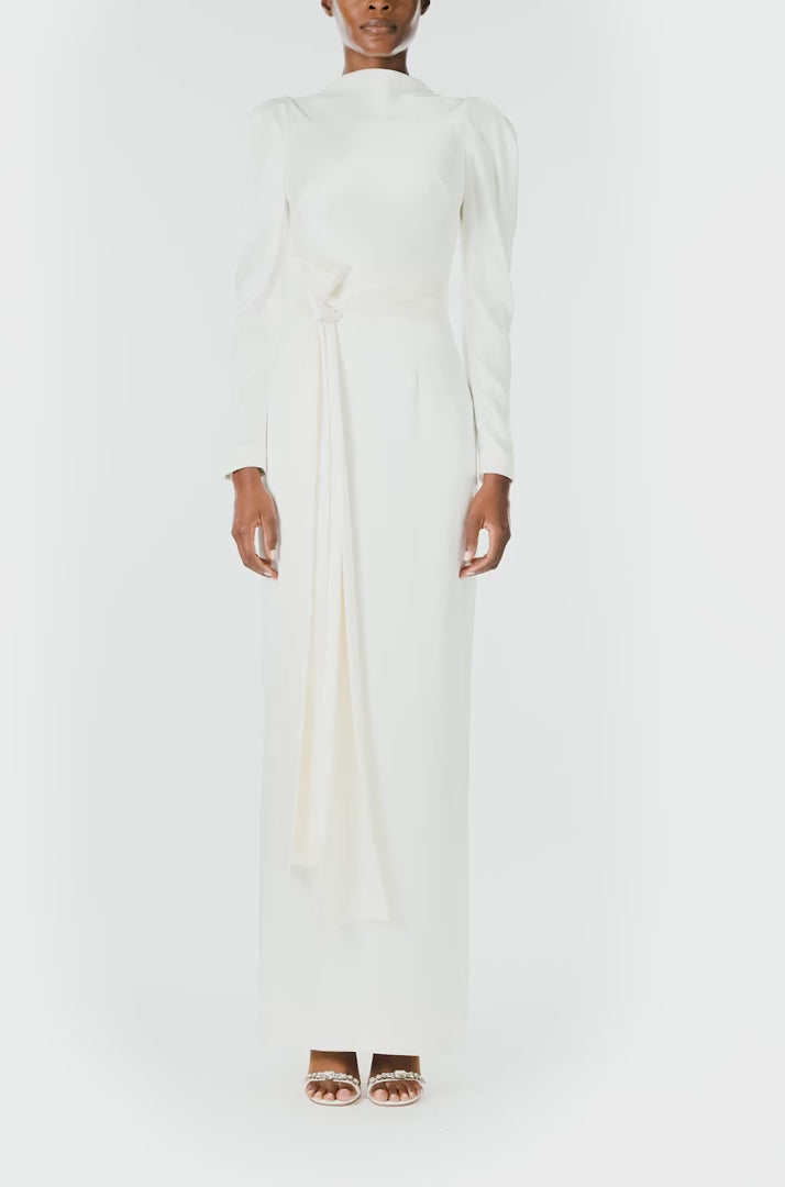 Monique Lhuillier Fall 2024 Long sleeve silk white satin gown with Bateau neckline, V-back and detached self-tie sash - video.