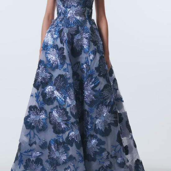 Monique Lhuillier Spring 2026 Lake/Multi Metallic Raffia Floral Embroidered Tulle Strapless ball gown - video.
