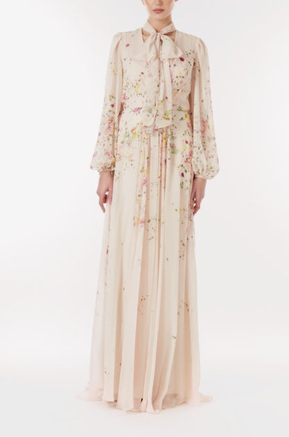 Monique Lhuillier long sleeve gown with attached necktie and gathered waist in buff floral printed chiffon.