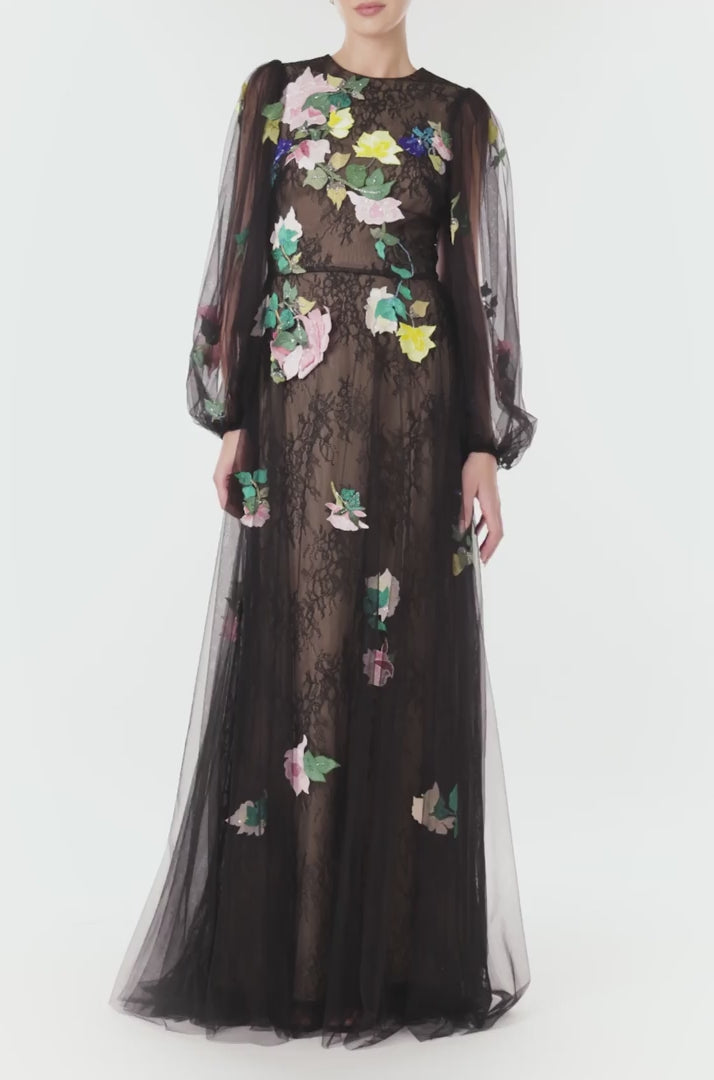 Monique Lhuillier Spring 2024 jewel neck, puff sleeve gown with sheer sleeves and floral embroidery over a lace underlay in black tulle - video.