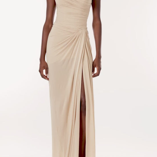 Monique Lhuillier strapless floor length gown with sweetheart neckline and high front leg slit in sand colored matte jersey fabric.