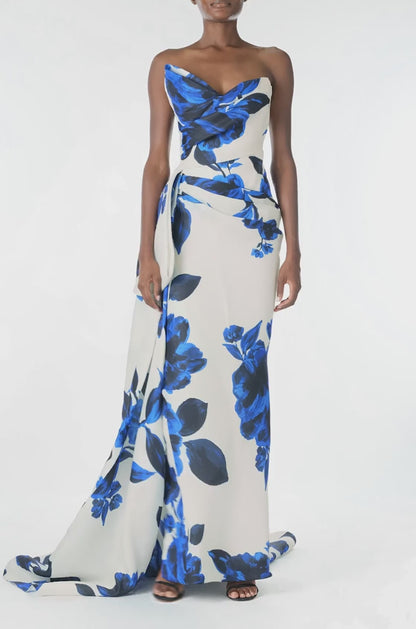 Monique Lhuillier Spring 2025 Strapless, column gown with asymmetric neckline, tufted draping and sweeping side train in Nautical Blue Floral printed gazar - video.