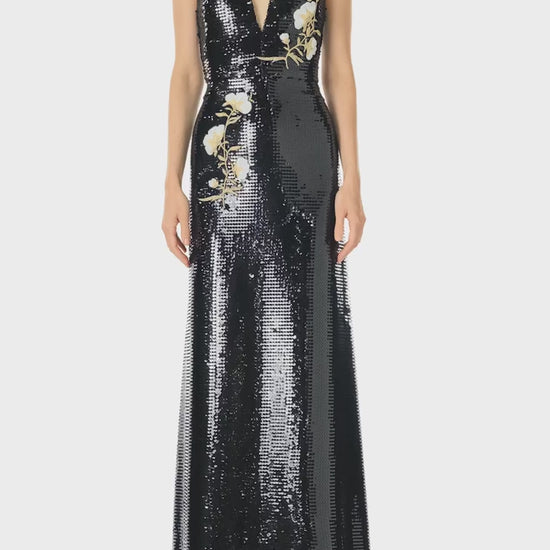 Monique Lhuillier Spring 2025 Deep V-neck gown in Noir sequin and floral embroidered appliques - video.