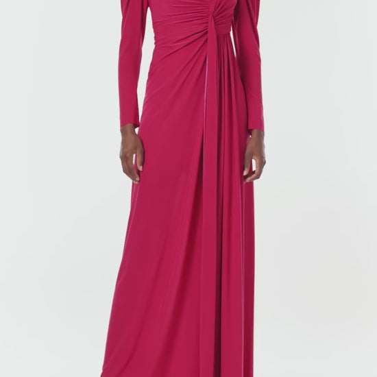 Monique Lhuillier Spring 2024 scarlet red matte jersey long sleeve, gown with draped bodice, jewel neckline and high front skirt slit - video.