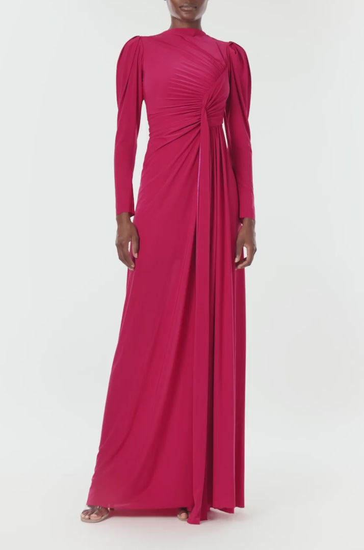 Monique Lhuillier Spring 2024 scarlet red matte jersey long sleeve, gown with draped bodice, jewel neckline and high front skirt slit - video.
