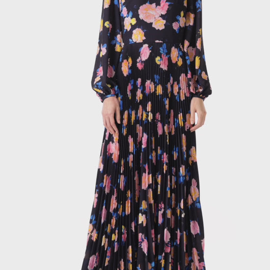 Monique Lhuillier long sleeve pleated gown in navy floral printed crepe fabric.