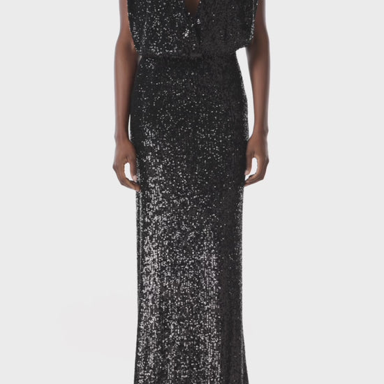 Monique Lhuillier black stretch sequin gown with deep v-neck front.