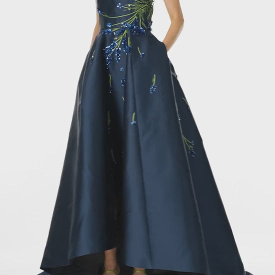 Monique Lhuillier Spring 2025 Strapless ball gown with high-low hemline and pockets in Lapis Mikado/Lavender embroidery - video.