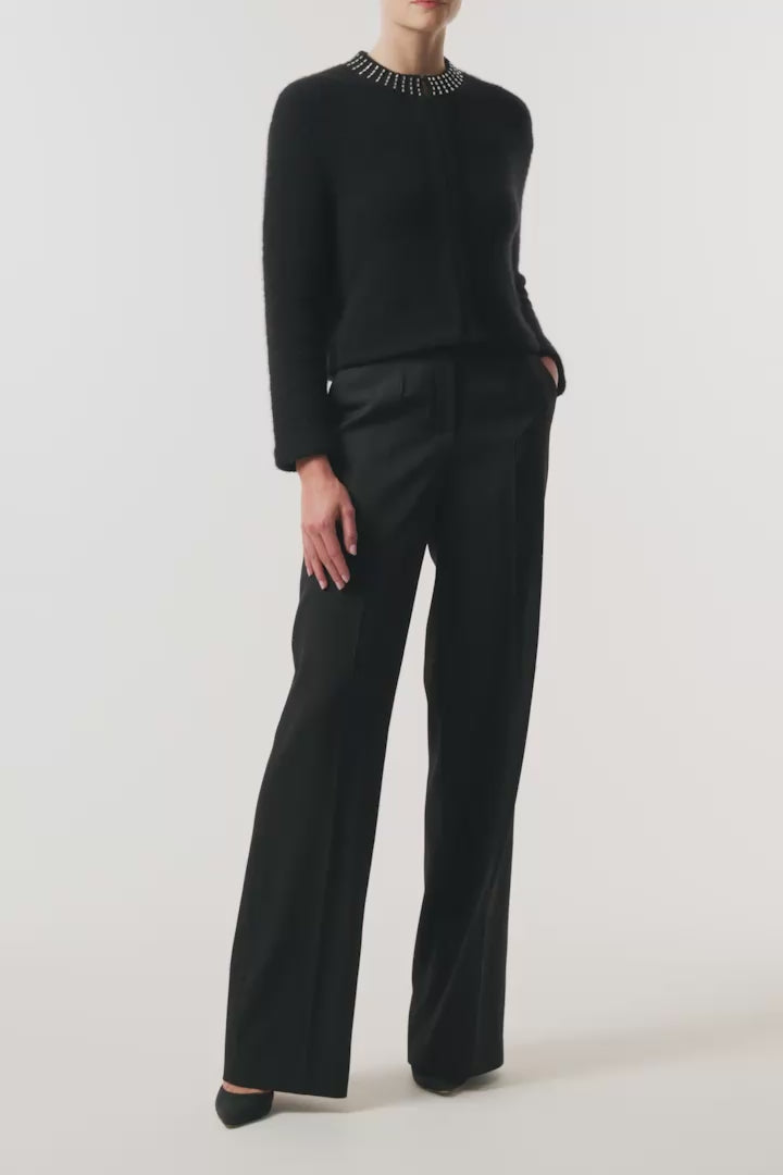 Monique Lhuillier Fall 2026 Noir bouclé knit jacket with crystal trim neckline and hook and eye closures - video.