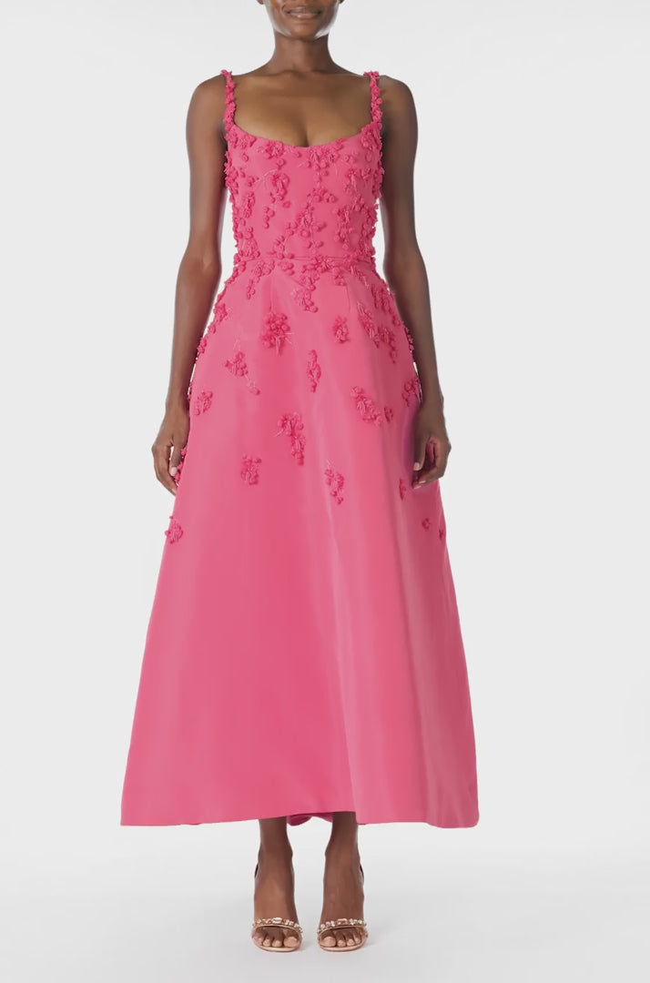 Monique Lhuillier Spring 2025 Tea-length dress with scoop neckline and spaghetti straps in Hibiscus floral embroidered faille fabric - video.