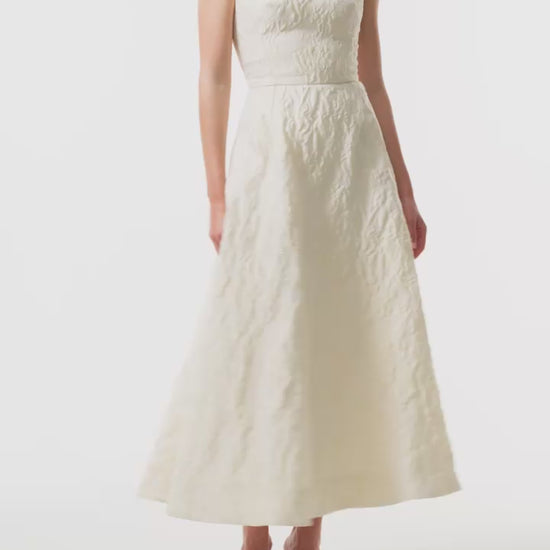 Monique Lhuillier Fall 2025 scoop neck, a-line dress in ivory floral jacquard fabric - video.