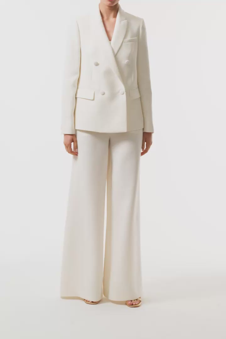 Monique Lhuillier Spring 2025 Long sleeve, double-breasted tuxedo jacket in Silk White wool/silk suiting - video.