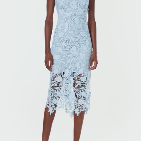 Monique Lhuillier Spring 2024 midi dress in pale blue lace with scalloped edging details.