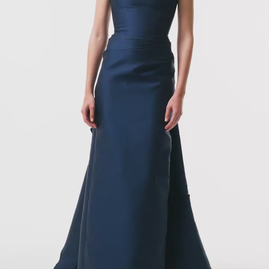 Monique Lhuillier Fall 2025 Ocean Mikado Draped column gown with integral train - video.