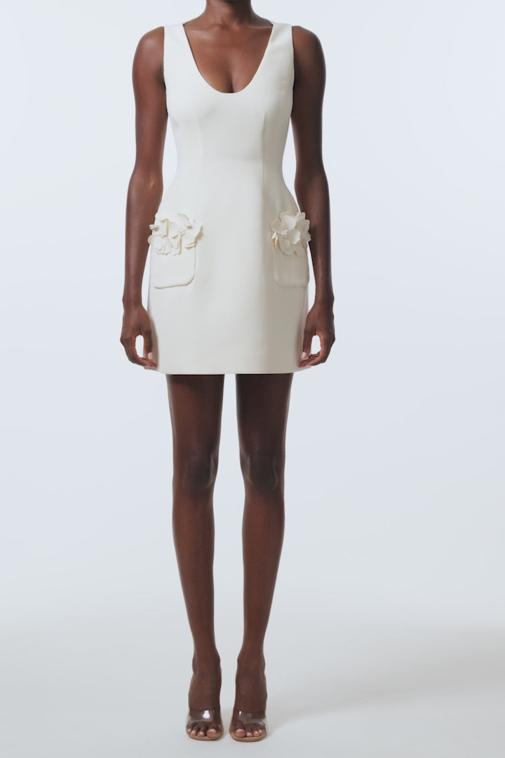 Monique Lhuillier Spring 2026 Ivory Lighweight Silk Wool Suiting Scoop neck dress with floral pockets - video.