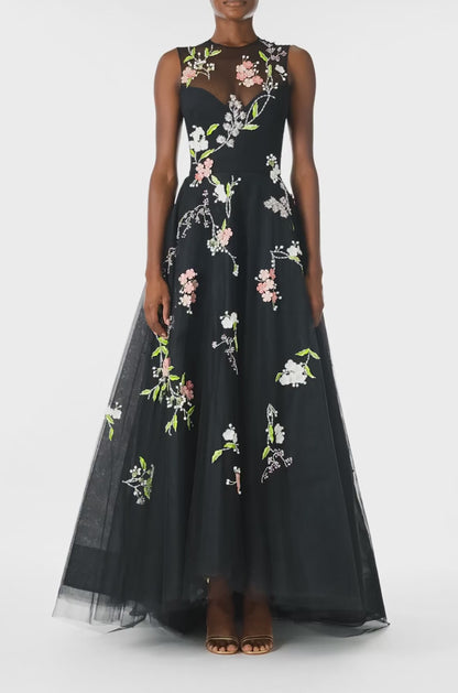 Monique Lhuillier Spring 2025 Sleeveless, noir tulle gown with floral embroidery and slight high-low hem - video.