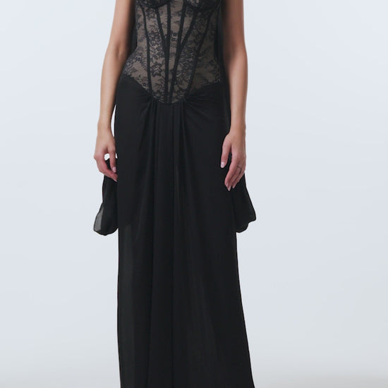 Monique Lhuillier Spring 2026 Noir lace and georgette corseted dropped waist gown with shawl - video.