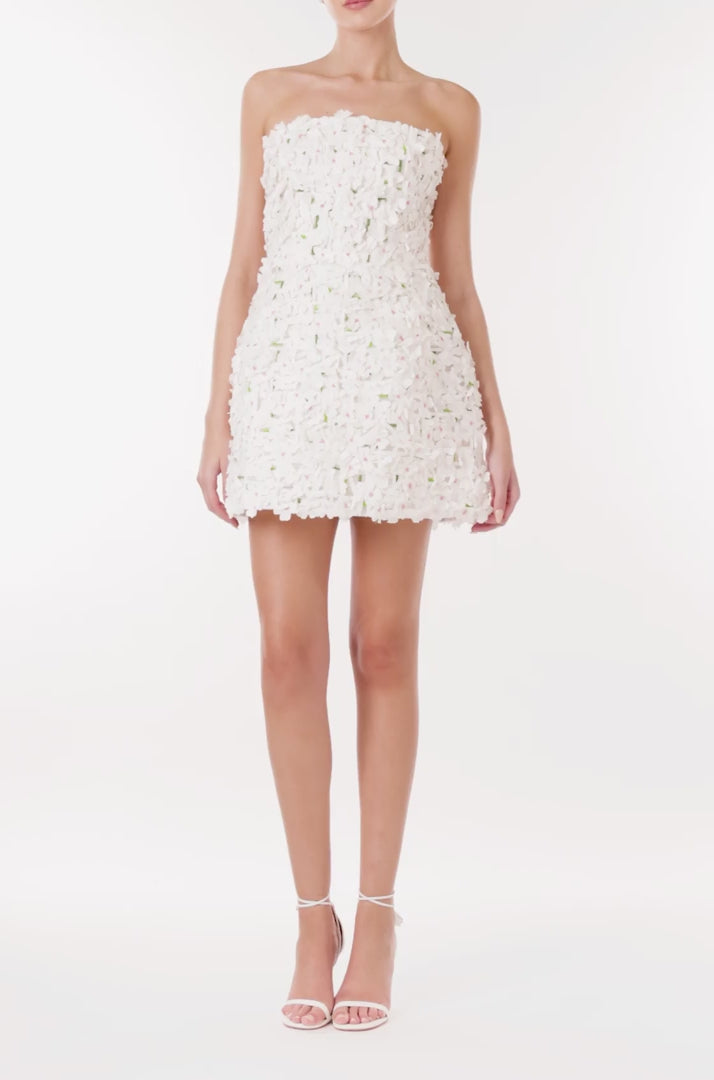 Monique Lhuillier strapless cocktail dress in silk white floral embroidery with hints of green and pink.