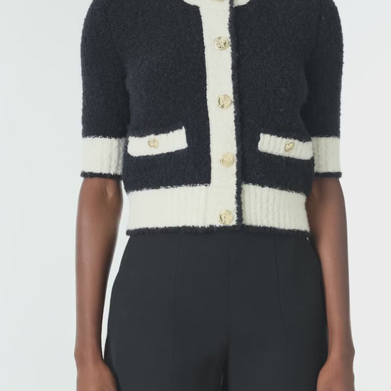 Monique Lhuillier Spring 2025 Short sleeve knit cardigan in Noir/Silk White Boucle - video.