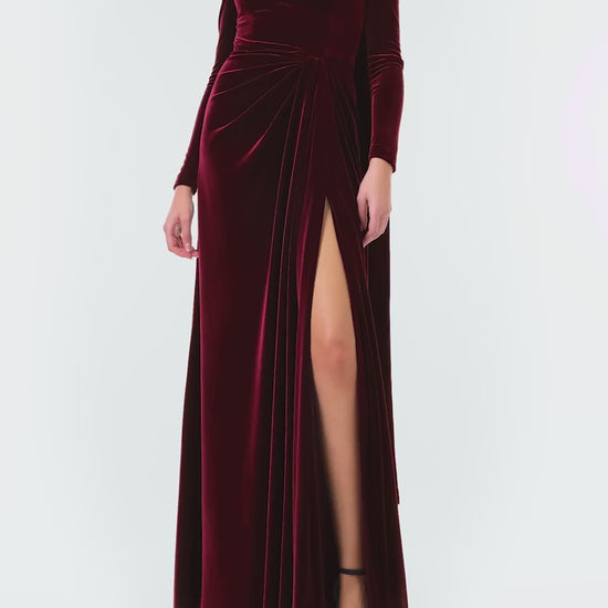 Monique Lhuillier Fall 2024 Long sleeve gown with square neckline, front skirt draping and detached neck scarf in Merlot colored stretch velour - video.