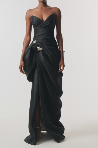 Monique Lhuillier Fall 2026 Noir Gazar strapless draped gown with sculpted skirt and silver floral embellishment - video.