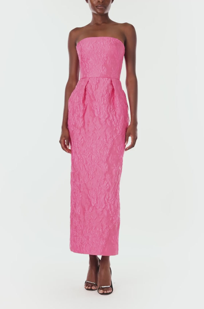 Monique Lhuillier Spring 2024 strapless midi length dress in fuchsia jacquard with tulip skirt and pockets - front.