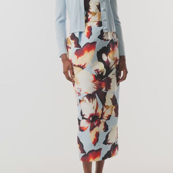 Monique Lhuillier Fall 2026 pale blue cashmere cardigan with floral applique - video.