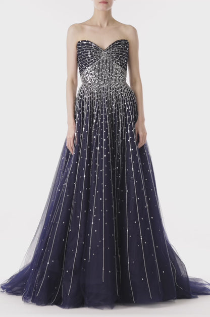 Monique Lhuillier strapless ballgown with sweetheart neckline in midnight tulle and silver embroidery.