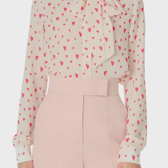 Monique Lhuillier Fall 2024 long sleeve, bow tie blouse in Heart Printed Georgette - video.