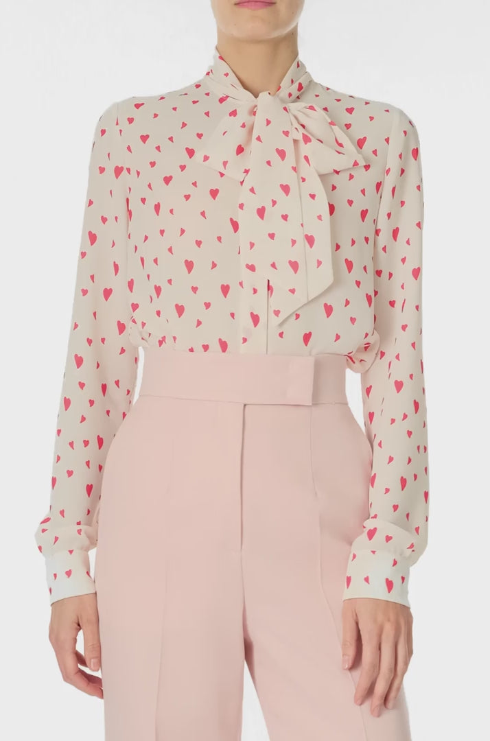 Monique Lhuillier Fall 2024 long sleeve, bow tie blouse in Heart Printed Georgette - video.