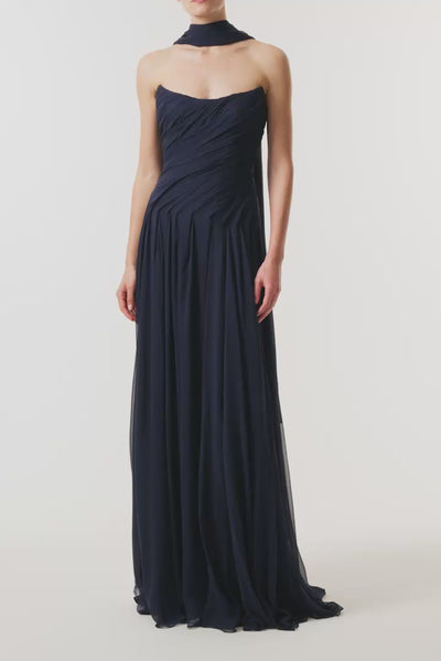 Monique Lhuillier Fall 2026 Navy chiffon strapless draped gown with scarf - video. 
