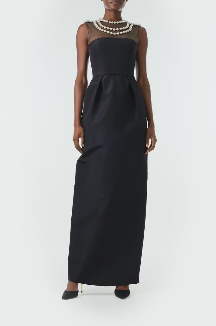 Monique Lhuillier Fall 2024 sleeveless, illusion neckline column gown in noir faille fabric with pearl embroidery and pockets - video.