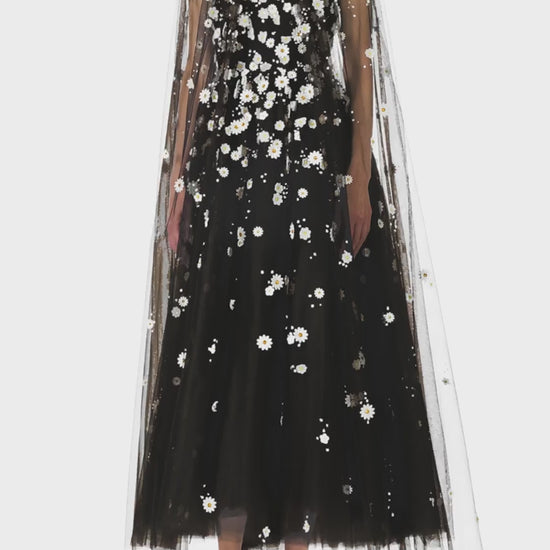 Monique Lhuillier Spring 2025 Noir tulle cape with Daisy embroidery and hook and eye closure at front of neckline - video.