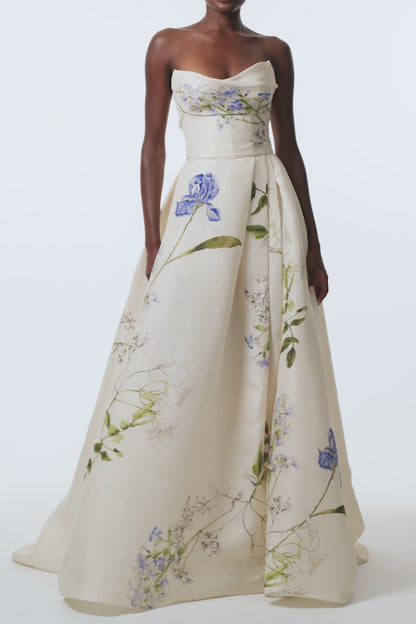 Monique Lhuillier Spring 2026 Ivory Multi Iris Bouquet Printed Gazar Draped bodice
ball gown with front skirt slit - video.