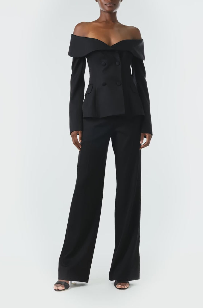 Monique Lhuillier Fall 2024 long sleeve corseted jacket with off-the-shoulder neckline in black wool - video.