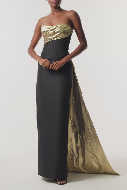 Monique Lhuillier Fall 2026 Noir/Gold lamé and faille strapless draped column gown and train - video.