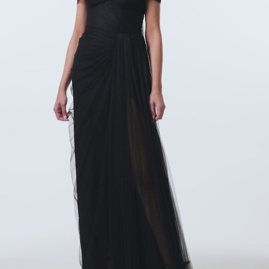 Monique Lhuillier Spring 2026 Strapless draped gown with detachable wrap
and streamers in Noir Spanish tulle- video.