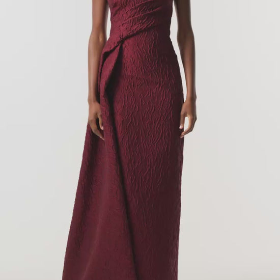 Monique Lhuillier Fall 2026 Rhubarb Jacquard strapless draped column gown with side train - video.