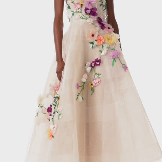 Monique Lhuillier pale blush colored strapless tulle cocktail dress with floral embroidery.