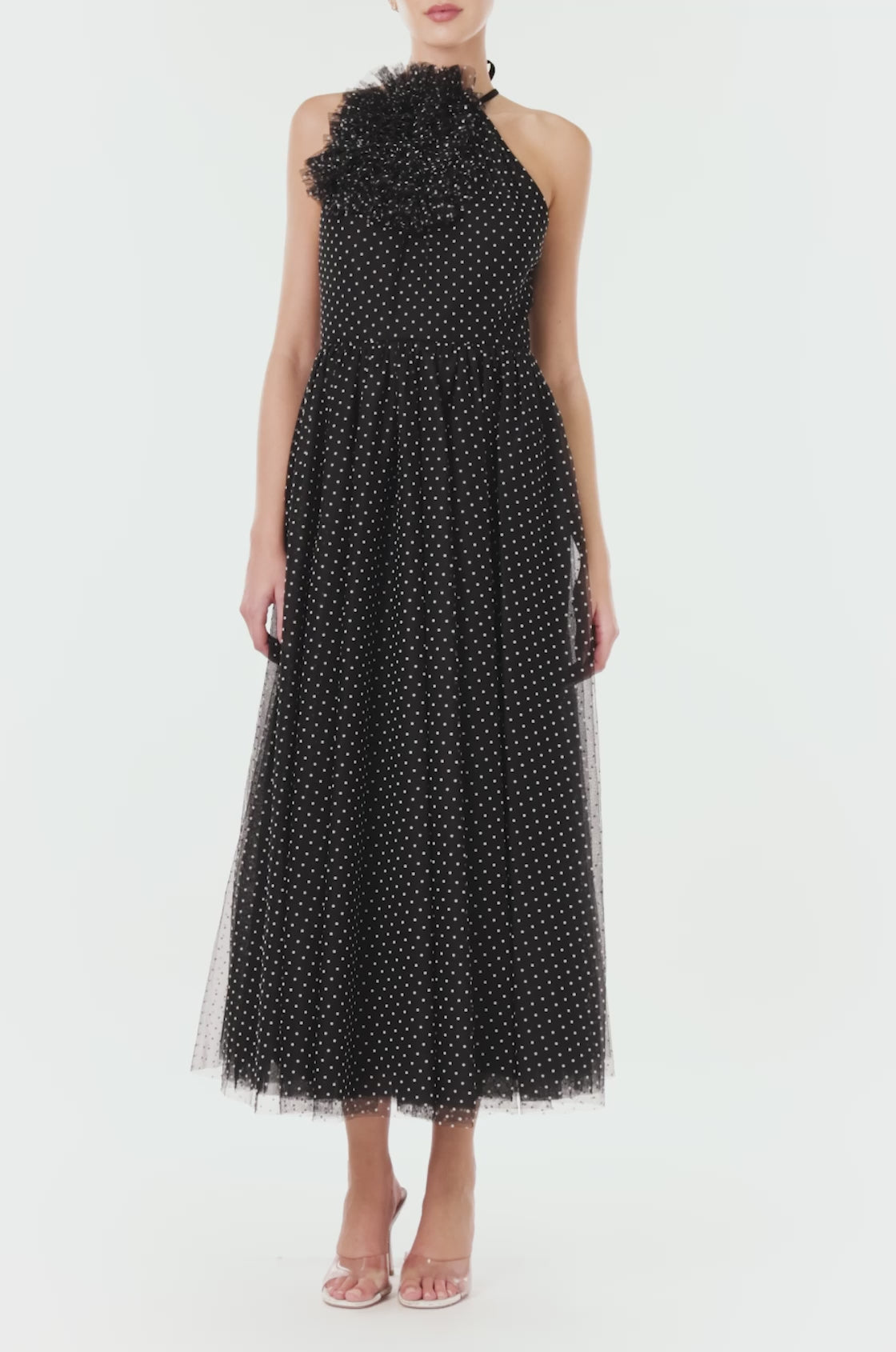 ML Monique Lhuillier midi length halter dress with puff accent at neckline in black and white dotted tulle fabric.