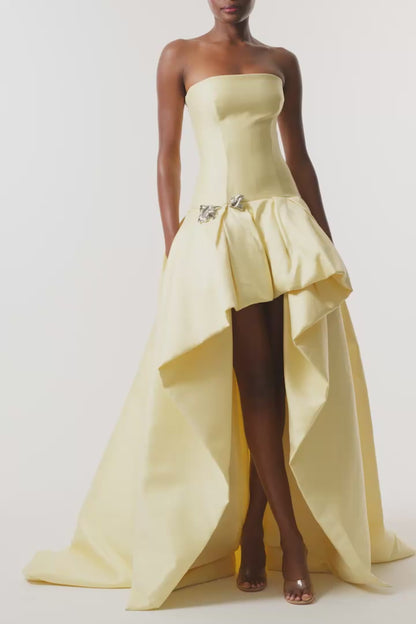 Monique Lhuillier Fall 2026 Pale Yellow Mikado Pique strapless ballgown with train and floral embellishment - video.