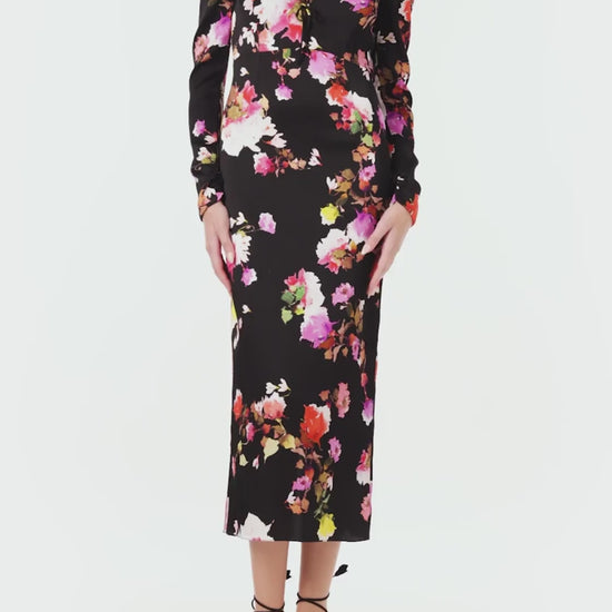 Monique Lhuillier Spring 2024 long sleeve midi dress with high neck and tied front keyhole bodice in black floral hammered silk - video.