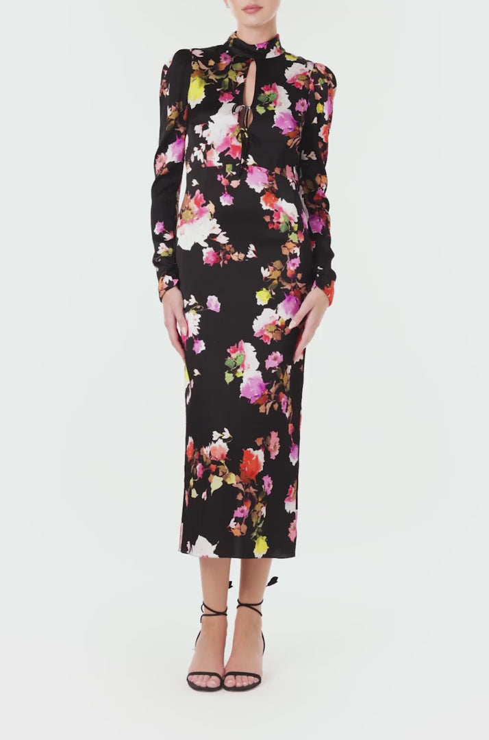 Monique Lhuillier Spring 2024 long sleeve midi dress with high neck and tied front keyhole bodice in black floral hammered silk - video.