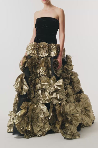 Monique Lhuillier Fall 2026 Noir/Gold velvet and embroidered lamé strapless dropped ballgown with three-dimensional floral skirt - video.