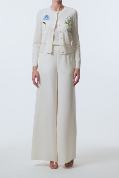 Monique Lhuillier Spring 2026  Ivory Cashmere long sleeve Cardigan with floral embroidery and pockets - video.