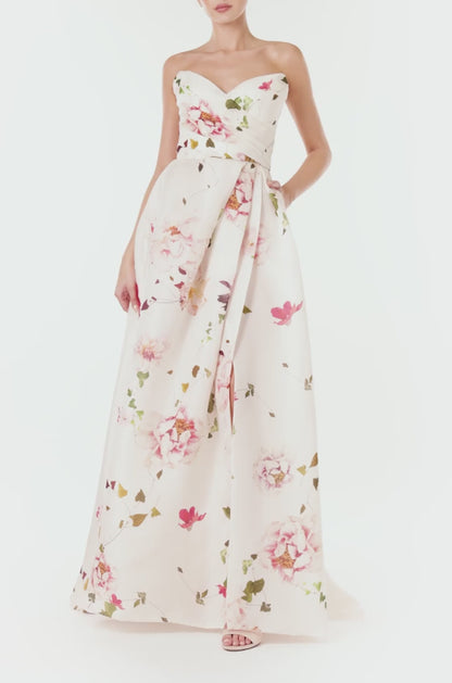 Monique Lhuillier strapless gown with sweetheart neckline and high leg slit in silk white floral gazar.